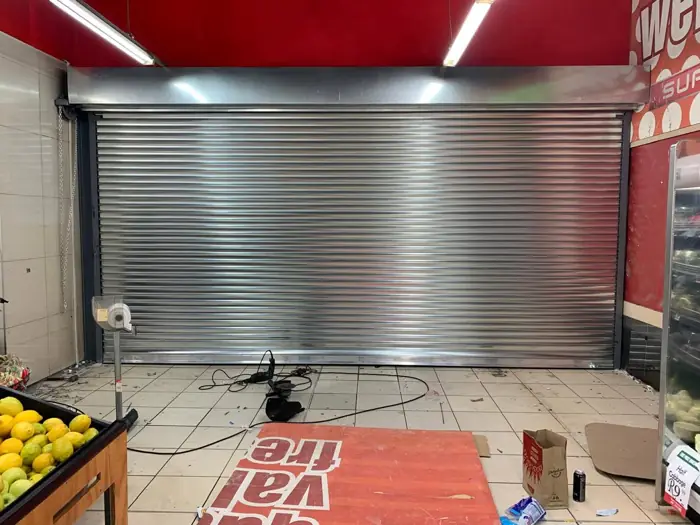 Galvanised roller shutter in a supermarket